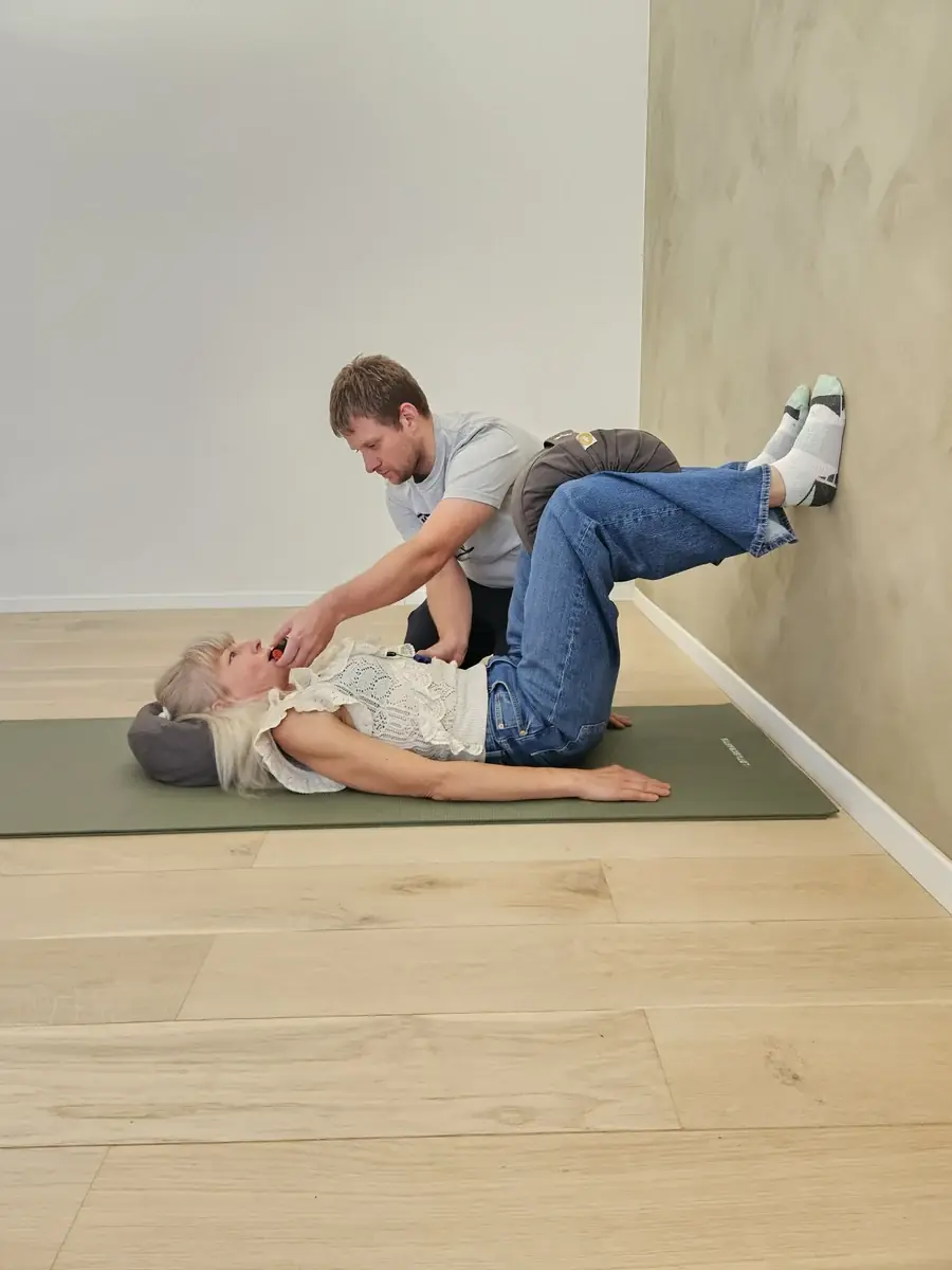 Breathing practice integrated with body position at the wall